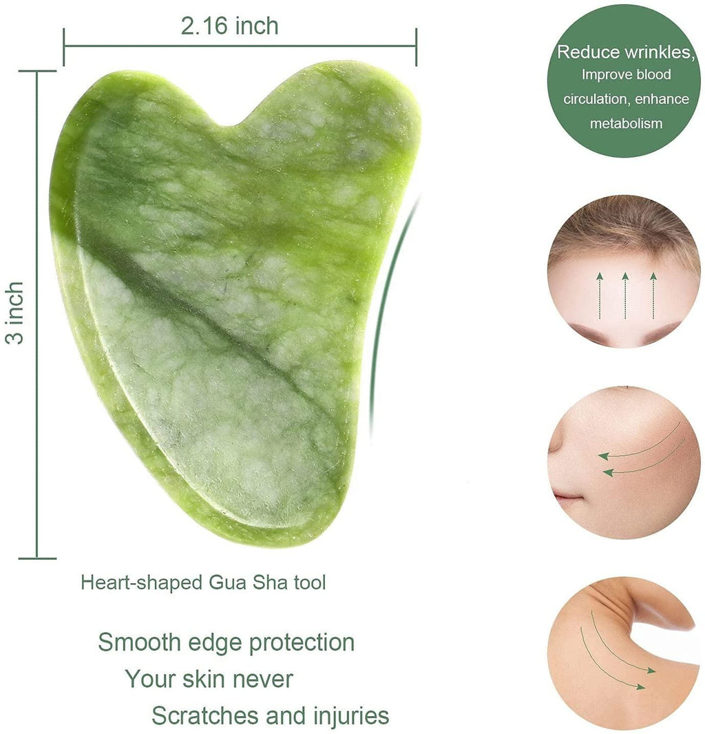 Natural jade stone roller and gua sha set on raw jade rocks